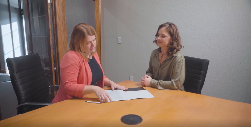 Attorney Danielle Cain in legal meeting with client at Spiros Law location
