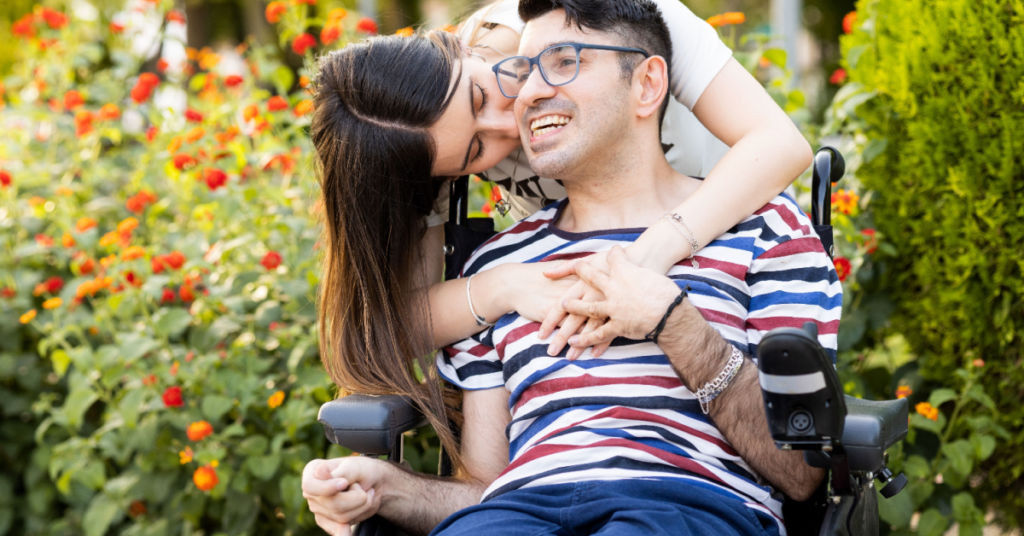 person with paralysis with loved one